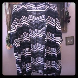 Torrid Lightweight cardigan with geometric design.